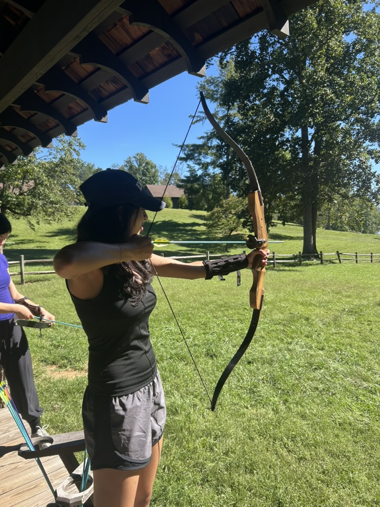 Milee practicing archery